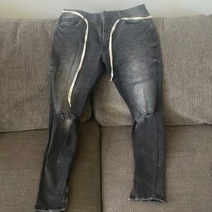 Black washed YoungLA distressed jeans with zippered ankles. Size 32/30